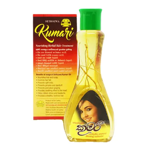 Bottle of Kumari Hair Oil with green cap next to a colorful product box featuring a woman’s image.