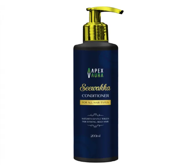 A dark blue bottle of Seewakka Conditioner with a gold pump top, labeled for all hair types.